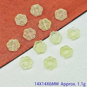 Close-up view of 14mm translucent lampwork sunflower beads for DIY jewelry crafts.