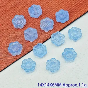 Detailed view of 14x14x6mm light blue sunflower glass beads for DIY jewelry crafting
