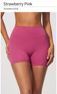 Close-up detail of high-waisted quick-dry yoga shorts in vibrant strawberry pink