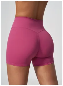 High-waisted magenta yoga shorts with quick-dry fabric and peach butt lift design