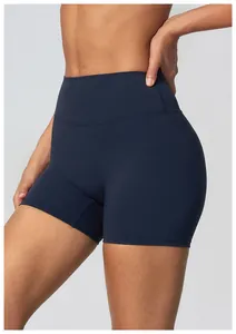High-waisted dark blue athletic yoga shorts for women in a professional studio view