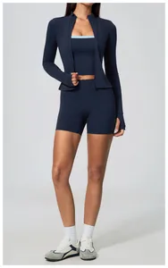 Professional full body view of a woman wearing navy high-waisted yoga shorts and jacket
