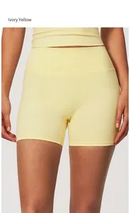Detailed view of ivory yellow high-waisted yoga shorts for women's fitness training