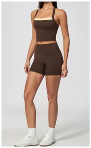 Studio view showing the full fit and design of brown high-waisted athletic shorts on a model