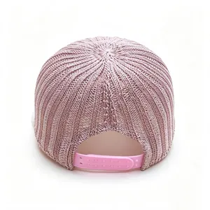 Detailed rear view of pink knitted breathable baseball cap with adjustable strap
