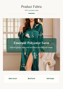 Emerald green satin robe detail with bird floral print and soft glossy fabric finish.
