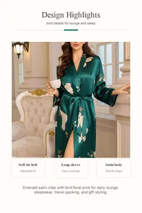 Detail of emerald green satin robe featuring bird floral print and adjustable self-tie belt.