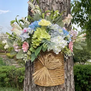 Colorful artificial flower arrangement in a rustic woven door basket for spring decor