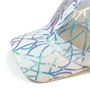 Close-up of white mesh baseball cap featuring iridescent geometric sequin patterns