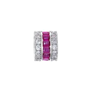 Detailed view of a silver-toned spacer bead featuring pink and white cubic zirconia stones.