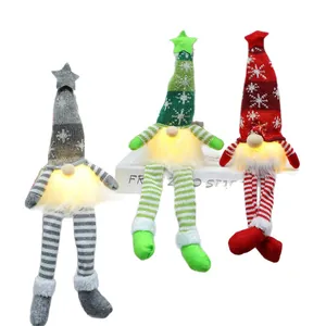 Set of three glowing Christmas gnomes with snowflake knitted hats and long dangling legs.