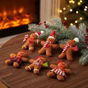 Detailed view of six charming plush gingerbread man Christmas tree hanging ornaments on a table