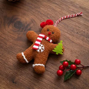 Adorable plush gingerbread man Christmas tree ornament with scarf and bow