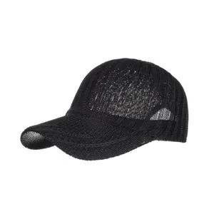 Close-up view of the detailed black hollow-out knitted breathable baseball cap texture