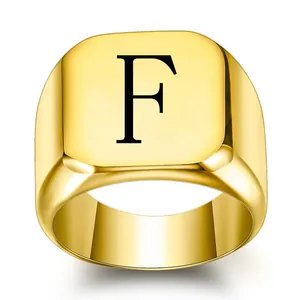 Detailed close-up of a vintage punk titanium steel square signet ring with letter F