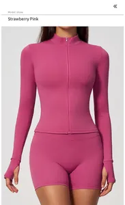 Detail view of strawberry pink slim fit zip-up long sleeve sports top for women.