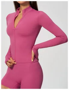 Detail of pink long sleeve zip-up sports jacket with convenient thumbholes