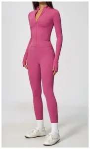 Slim fit pink yoga set with zip-up jacket and high waist leggings for gym workout