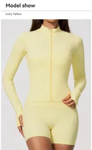Detail of ivory yellow zipper sports jacket with thumb holes for fitness training