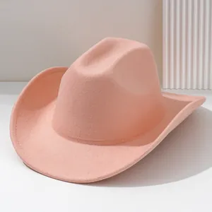 Detailed view of a solid pink felt western cowboy hat with minimalist wide brim design