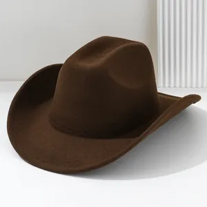Detailed view of a solid brown felt cowboy hat showing the texture and curved wide brim