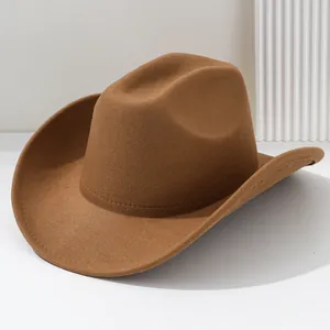 Classic brown felt cowboy hat with wide curved brim and minimalist unisex style.