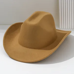 Detailed view of camel felt cowboy hat featuring a wide curved brim and classic crown