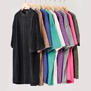 Heavy cotton washed distressed t-shirts in various colors hanging on wooden racks