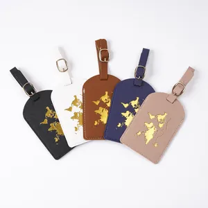 Detail view of five multi-colored leather luggage tags with gold foil world map patterns