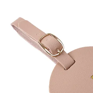 Close-up detail of thickened PVC luggage tag with adjustable golden metal buckle