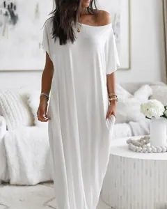 Detailed view of the soft white off-shoulder maxi dress with practical side pockets.