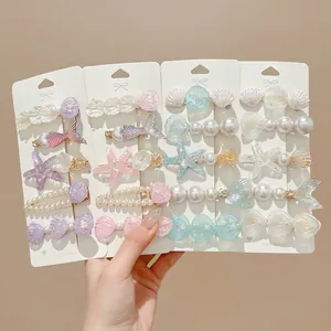 Elegante juego de pinzas para el cabello con perlas y conchas para la playa en verano