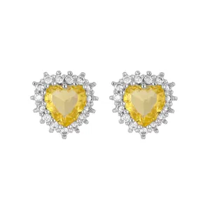 Elegant heart-shaped stud earrings with yellow zircon and micro-set white halo stones.
