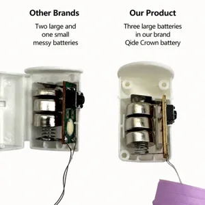 Internal view of LED pop tube stress toy showing battery compartment with 3 cells.
