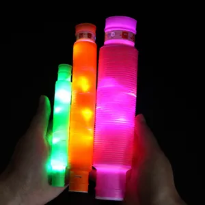 Comparison of small, medium, and large LED glowing pop tubes in dark background