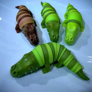 Sammlung bunter 3D-gedruckter beweglicher Krokodil-Fidget-Spielzeuge zum Stressabbau Spaß.