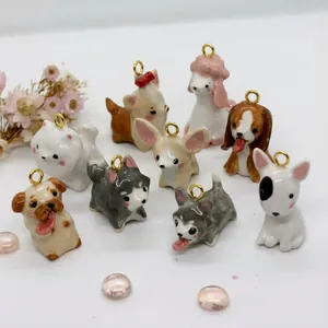 A collection of cute cartoon dog animal pendants featuring various breeds in vibrant colors