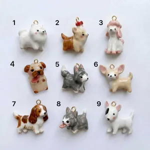 Detailed view of nine unique cartoon dog pendants with colorful drip oil finishes