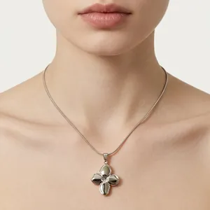 Elegant silver four-leaf clover necklace with polished geometric pendant for women
