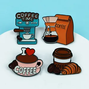 Macro shot of creative coffee themed enamel pins for backpacks and jackets.