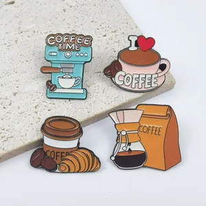 Detailed view of four colorful coffee-themed enamel pins on a textured stone surface.