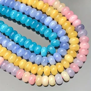 Macro view of colorful 5x8mm crystal chalcedony abacus beads for DIY jewelry making.