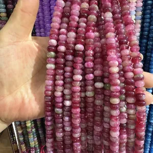 Macro detail of pink 5x8mm crystal abacus beads for DIY necklace and bracelet crafting