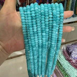 Close-up detail showing the smooth texture of 5x8mm turquoise abacus beads for DIY jewelry making.