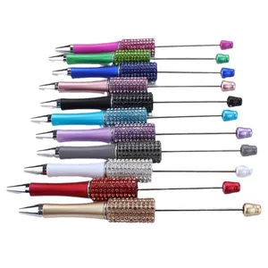 Set of colorful DIY beaded ballpoint pens with shiny rhinestone accents and metal rods