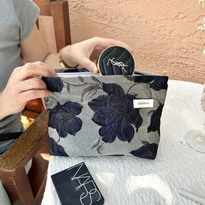 Elegant floral embroidered cosmetic bag with large capacity for daily makeup storage