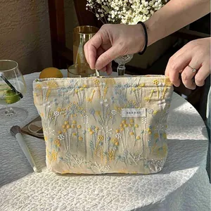Elegant floral embroidered cosmetic bag with large capacity for portable travel organization