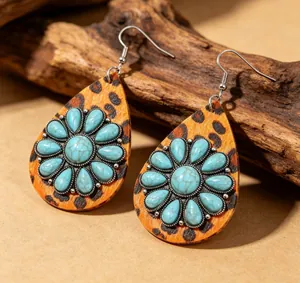 Detail showing the leopard print leather and turquoise stone of the western earrings.