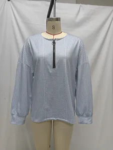 Classic blue and white striped long sleeve top featuring a zipper neckline on a mannequin
