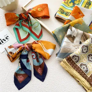Elegant 70cm printed silk scarf featuring vibrant floral and geometric patterns